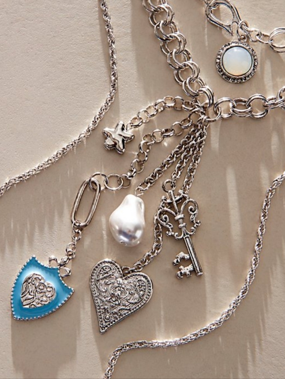 NWT Free People Tate Layered Necklace Silver Tone Blue Accent Key Heart Starfish